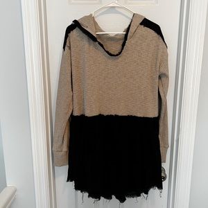 Peplum Beige and Black Sweater with hood and unfinished hem.
